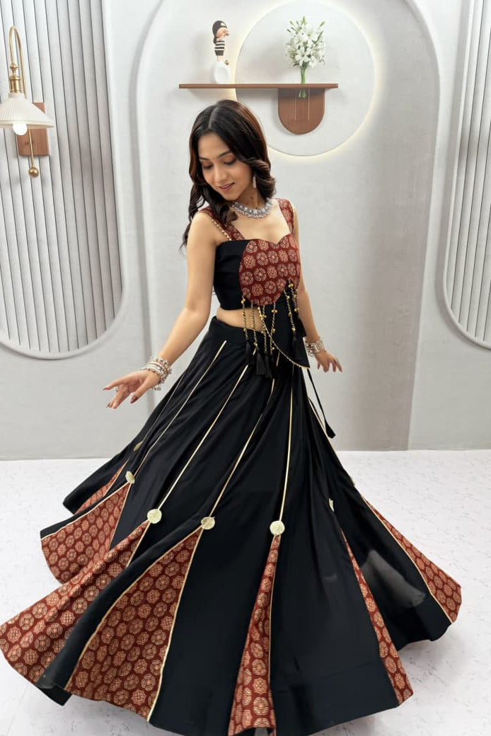 Ajrak Lehenga Choli front view showing maroon print, black skirt and decorative tassels