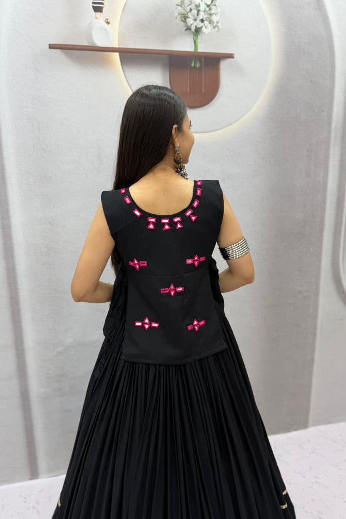Back view of black Navratri Chaniya Choli showing pink neckline motifs and structured choli design