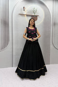 Front view of black Navratri Chaniya Choli with pink detailing and a wide 6-meter lehenga flare
