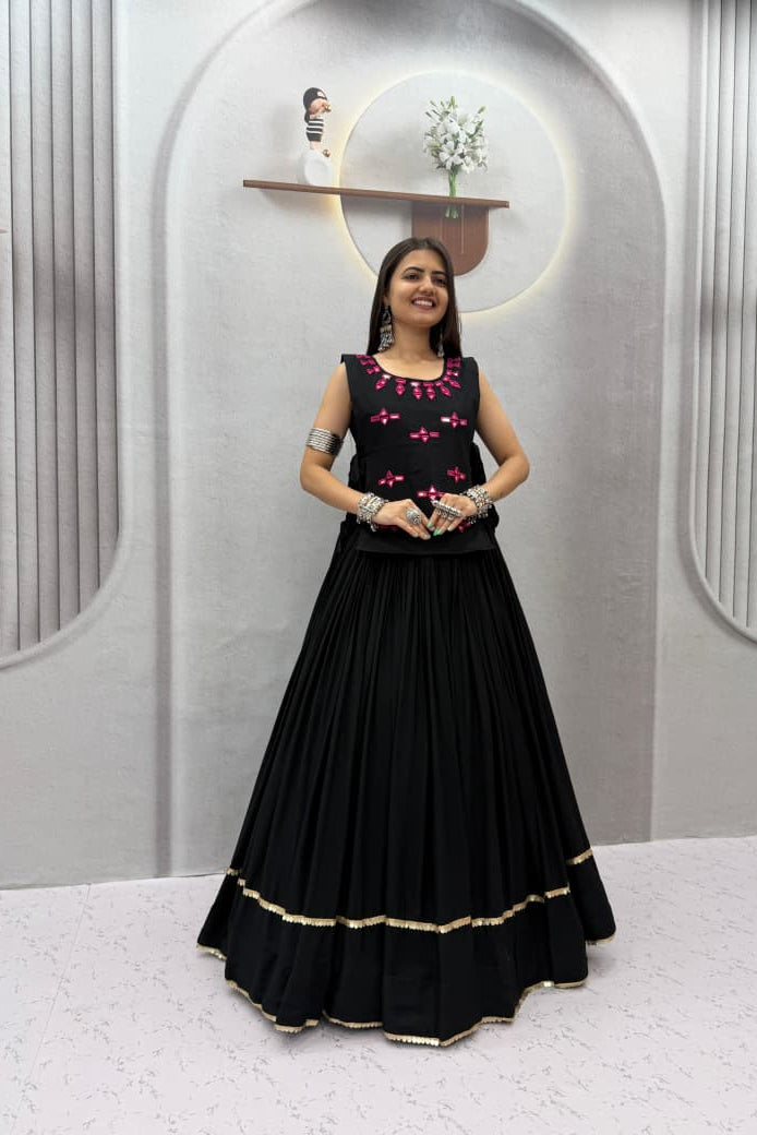 Front view of black Navratri Chaniya Choli with pink detailing and a wide 6-meter lehenga flare