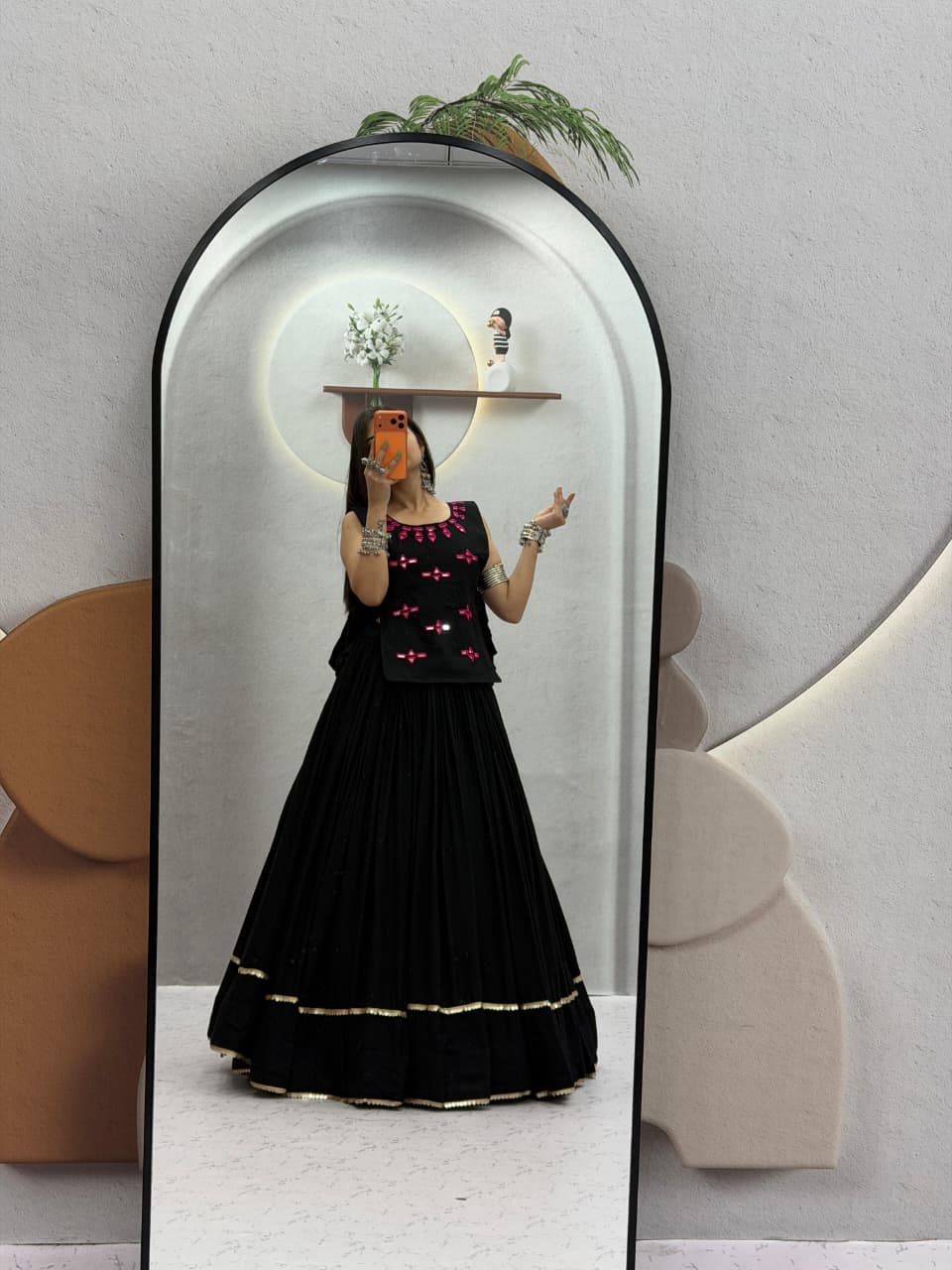 Black Navratri Chaniya Choli shown in mirror with a flared Rion cotton lehenga and festive detailing