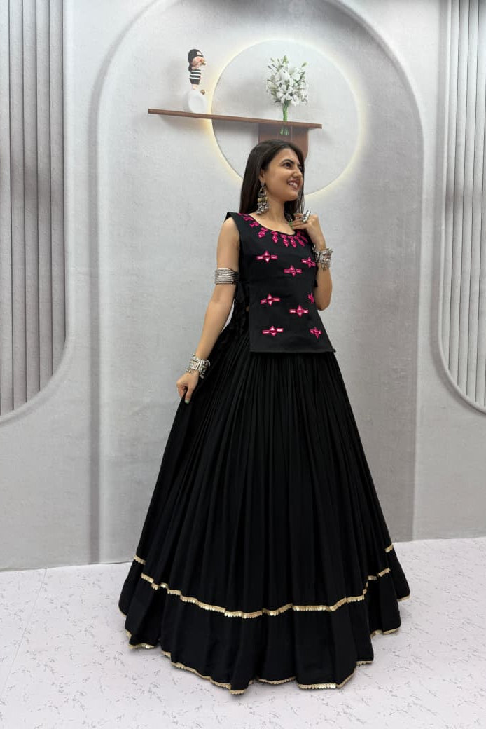 Black Navratri Chaniya Choli side pose highlighting the flared lehenga and gold border finish