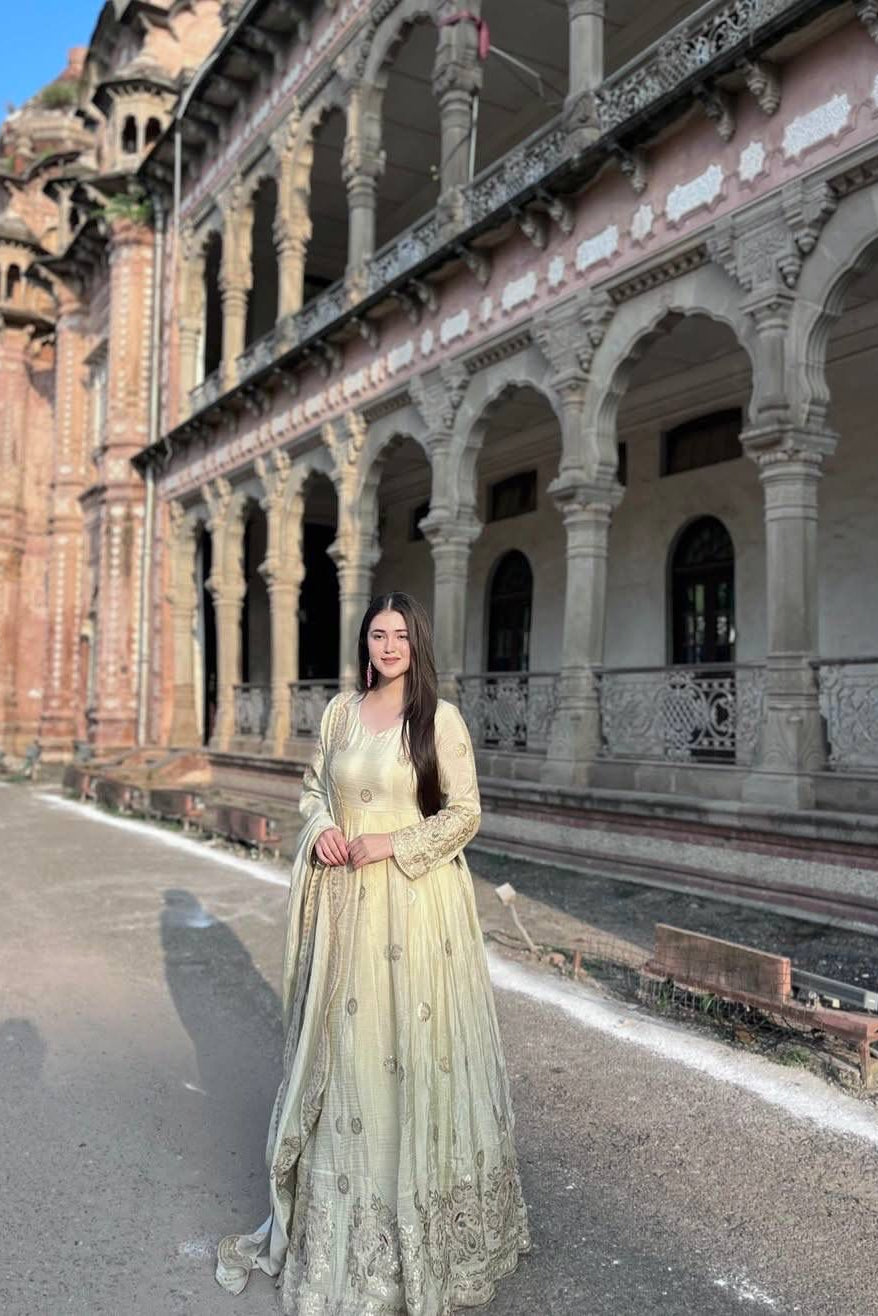 Chinon silk Anarkali gown shown from the side with detailed sleeves and matching embroidered dupatta