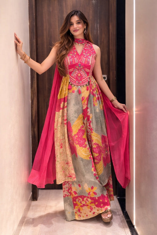 Woman wearing a premium Chinon suit set with printed lower and pink dupatta