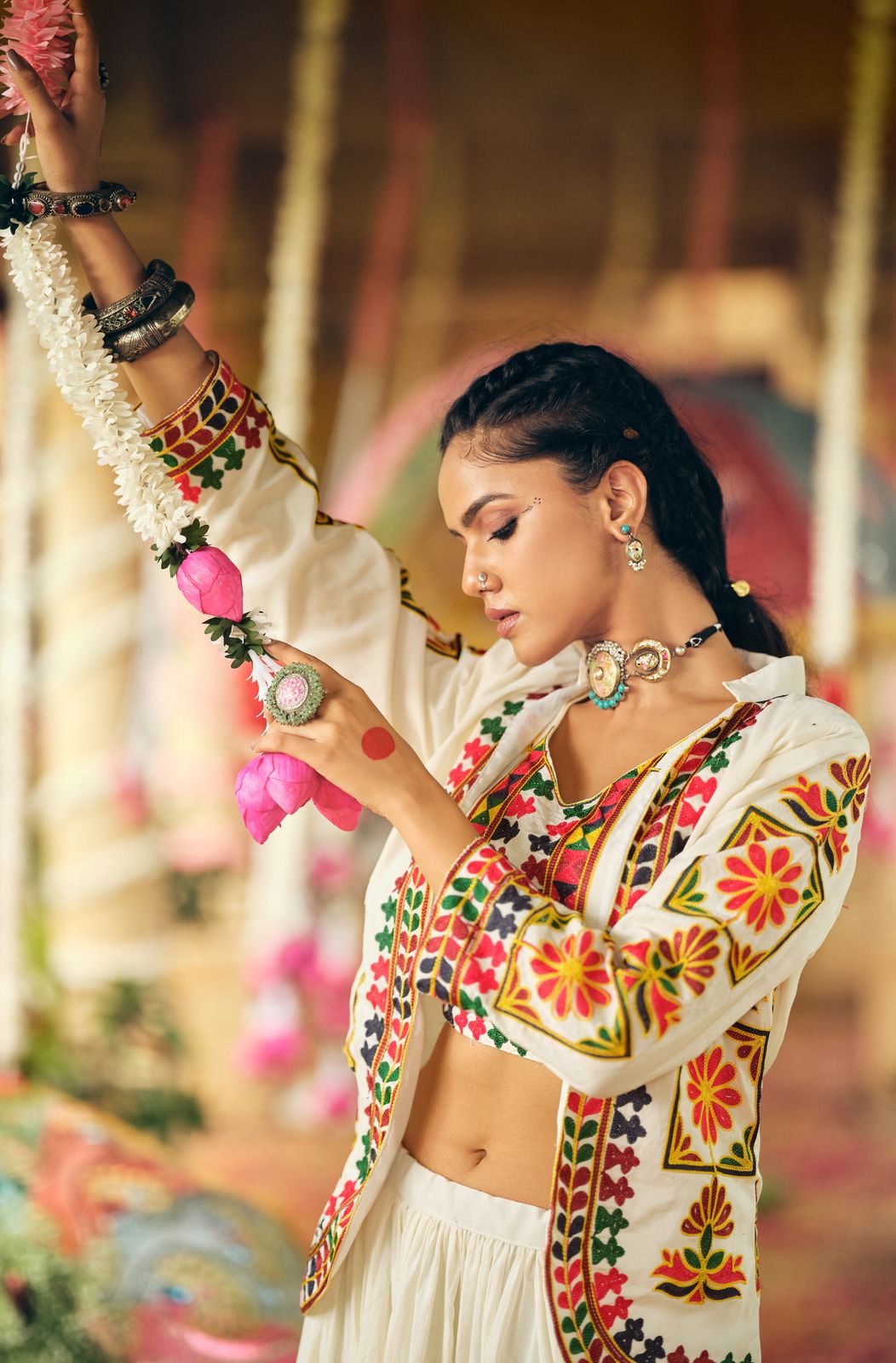Indian cotton lehenga choli set with colorful embroidered koti in a festive traditional setting