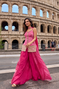 Designer Indo-Western pink sharara suit with printed flared sharara and embellished slit-style top