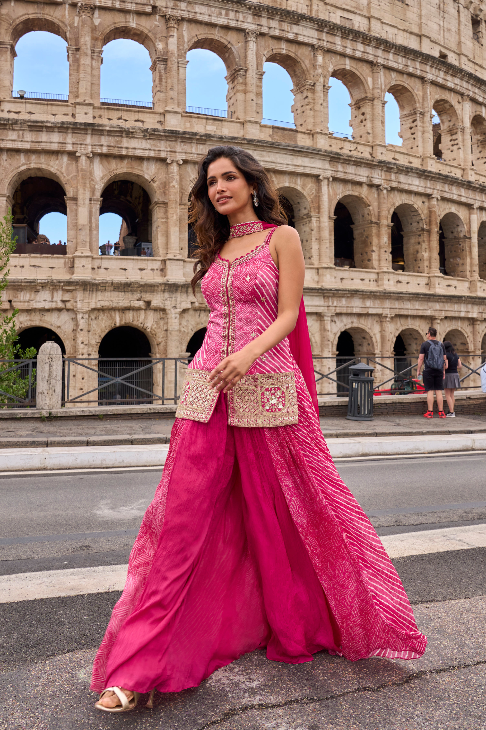 Designer Indo-Western pink sharara suit with printed flared sharara and embellished slit-style top