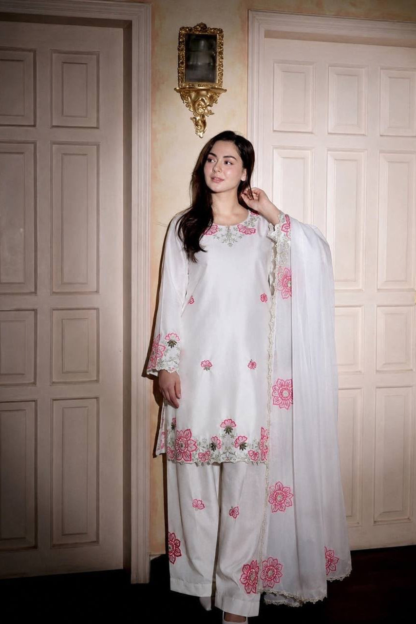 White Farshi Shalwar Suit with heavy embroidery and sequins, styled with an elegant organza dupatta