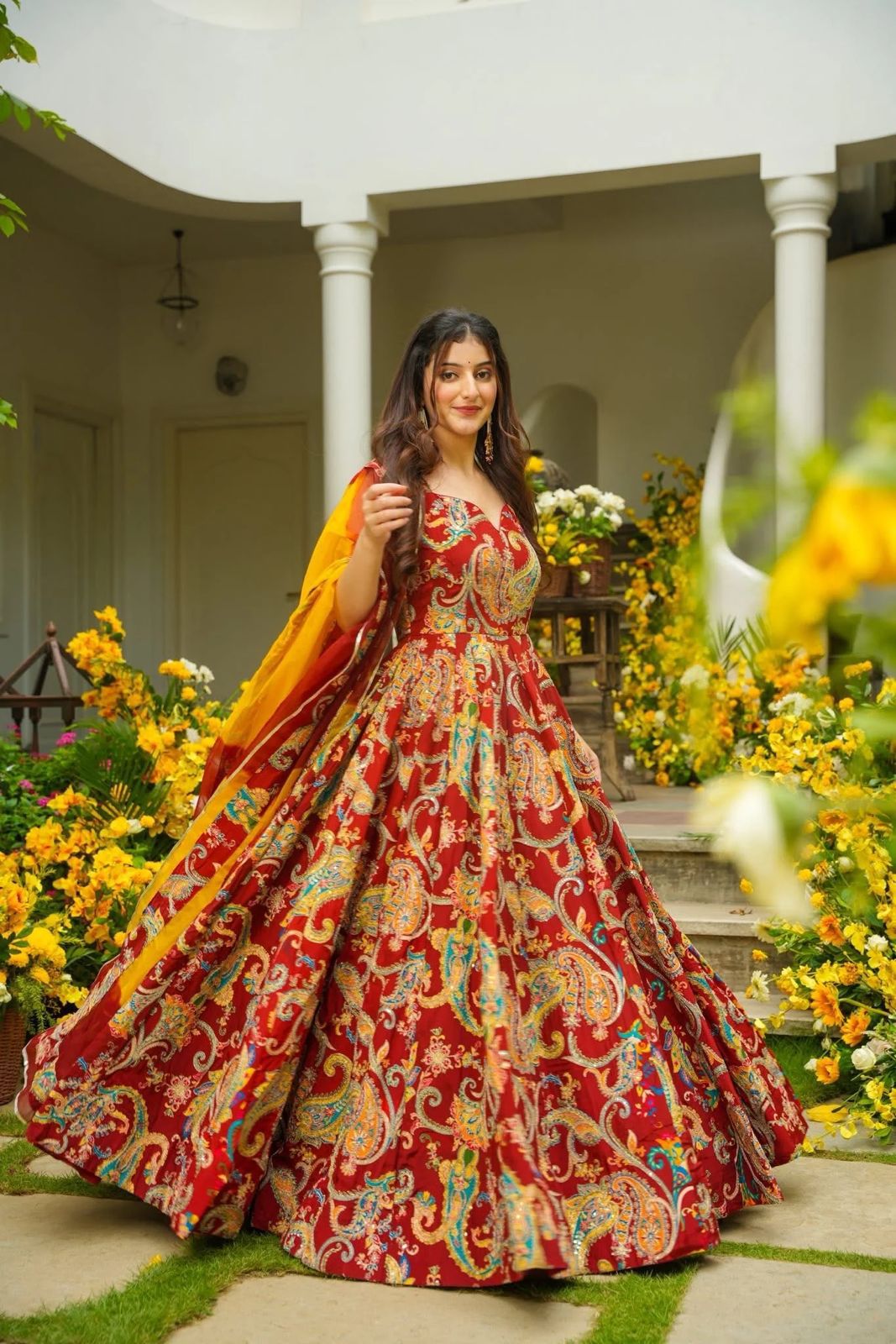 Wide-flair Anarkali gown showcasing its flowing printed skirt and dupatta