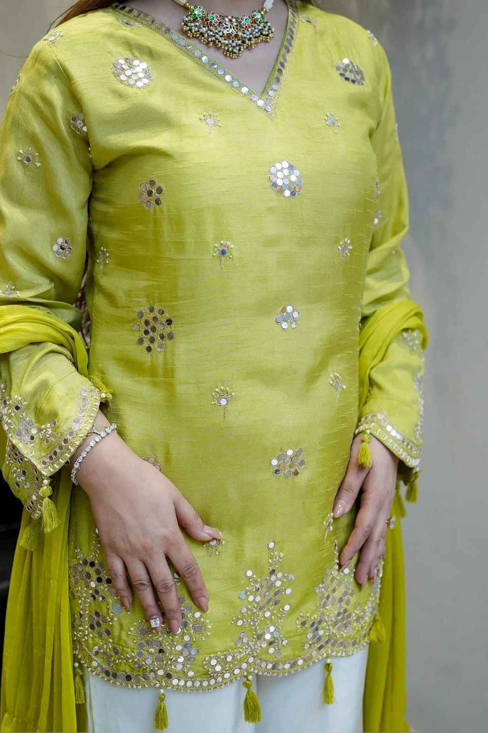Full-length lime green Indian kurta set with sequin embroidery, heavy Nazmin dupatta and white viscose silk pants