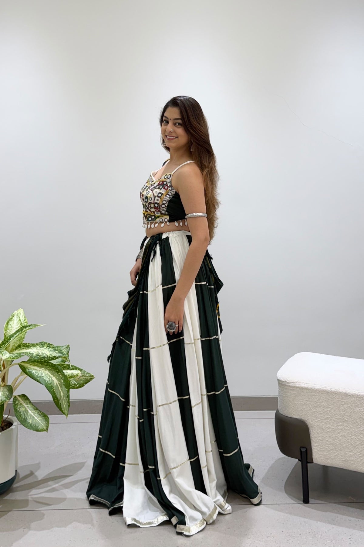 Green and ivory pleated Navratri lehenga showing its flowing full-flair silhouette