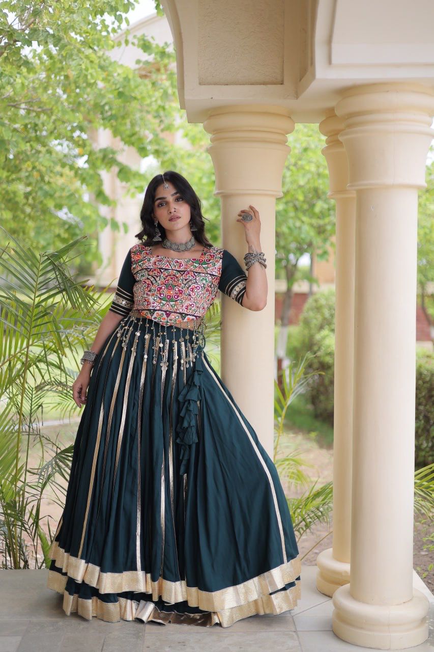 Green Reyon lehenga choli with vertical detailing, mirror accents and Gota Patti hem