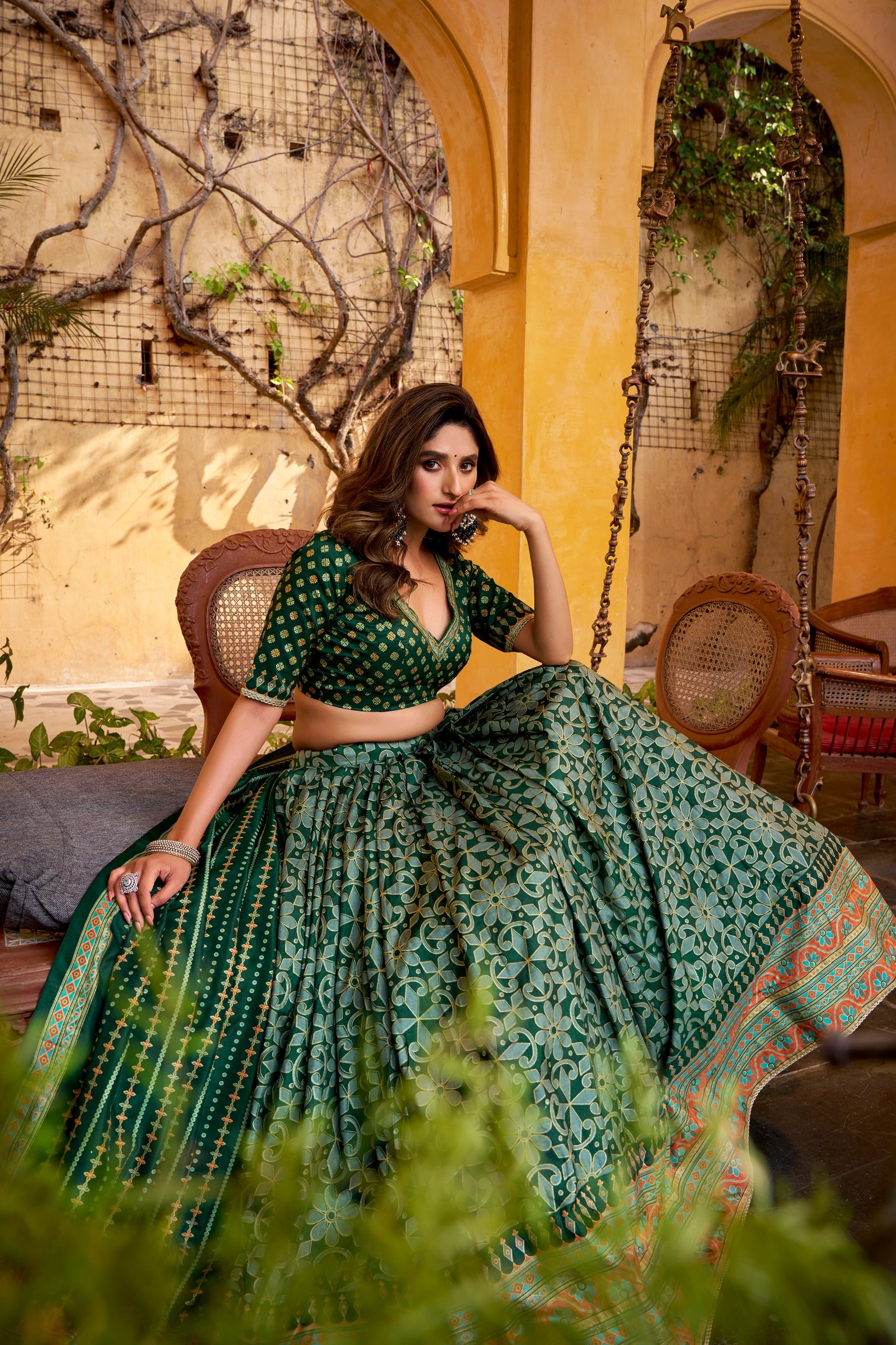 Green Tasar Silk Lehenga with patterned skirt, matching blouse and colorful bordered dupatta