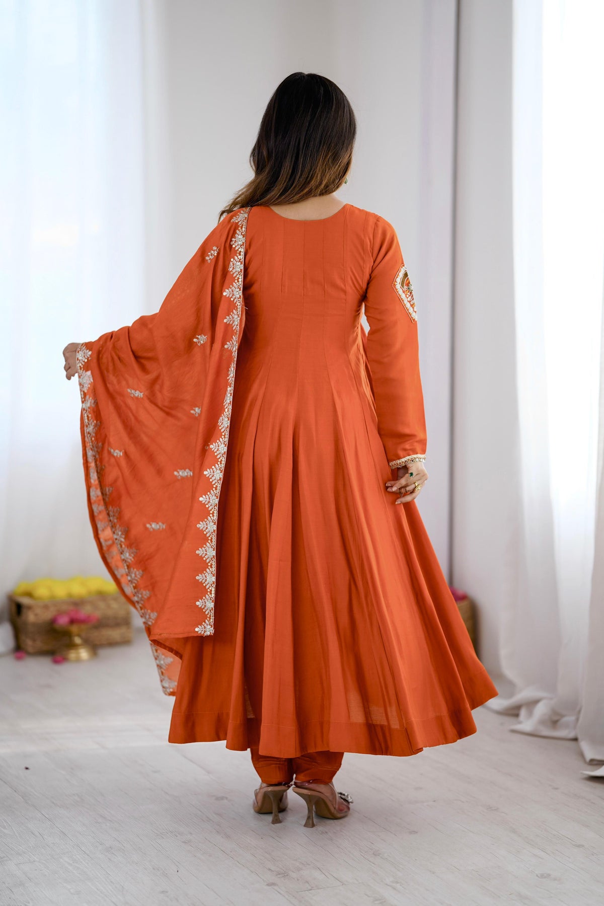 Back view of Indian Anarkali dress showing the flowing full-length gown silhouette