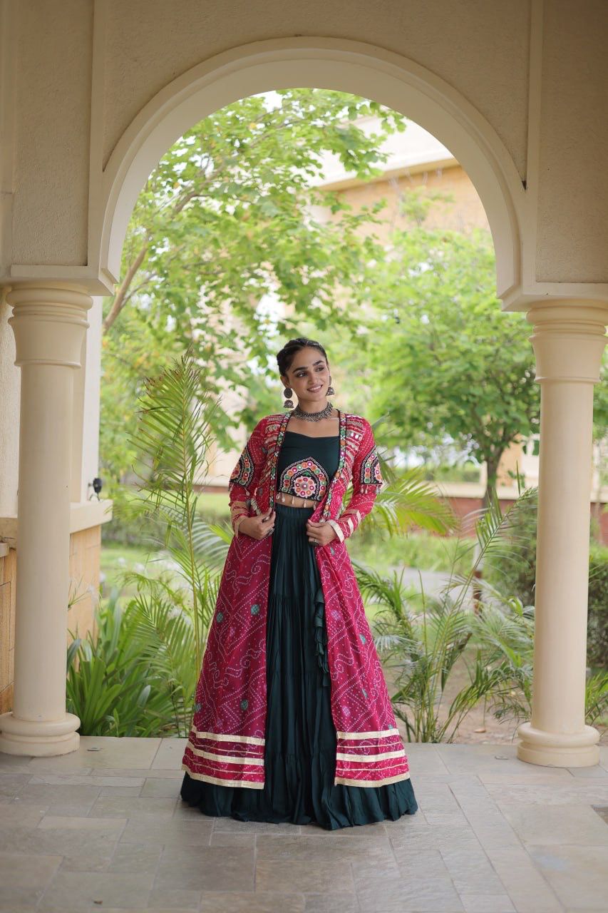 Indian festive lehenga choli styled with a pink Bandhani shrug and traditional Kutchi details