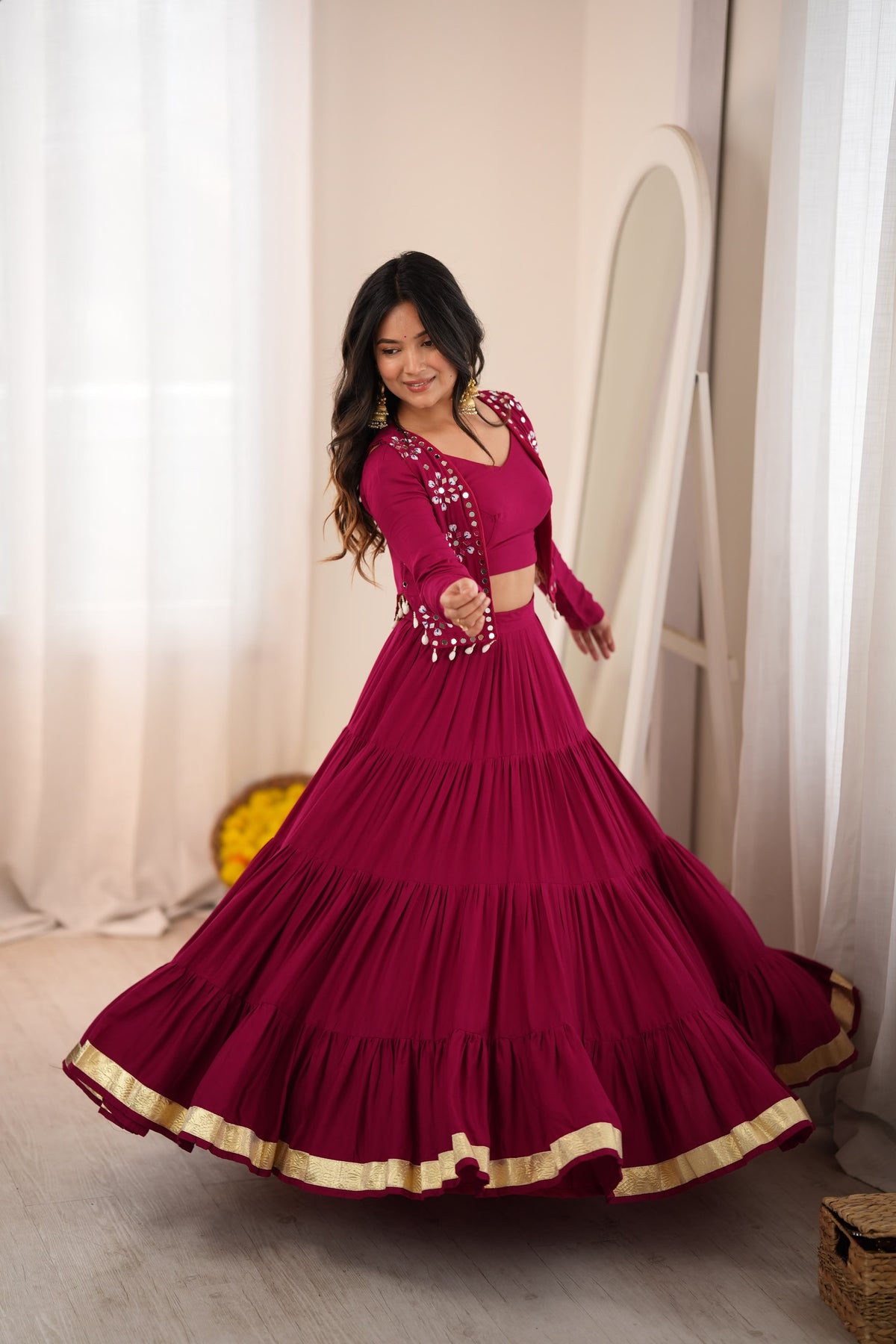 Magenta Indian lehenga choli with Gota Patti border and dramatic 9-meter flair