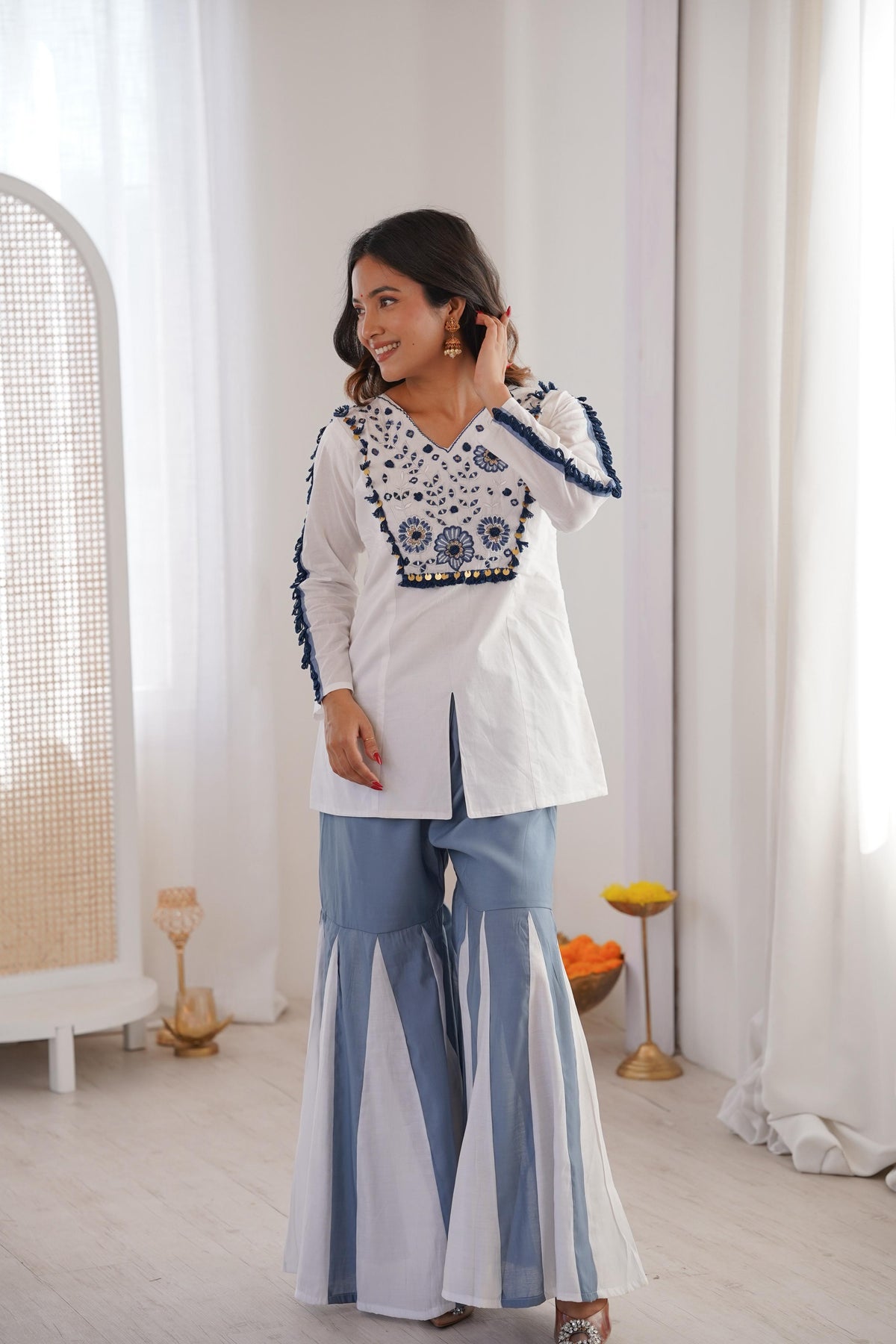 Side view of Roman Silk Kurta Palazzo Set with blue lace and embroidered details