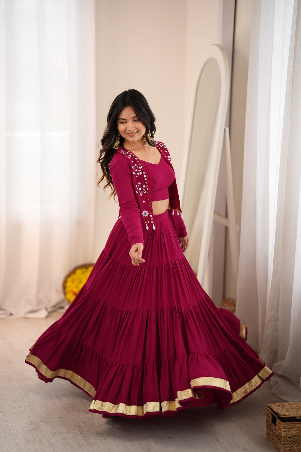 Magenta Gota Patti lehenga choli showcasing the flowing skirt and traditional gold border