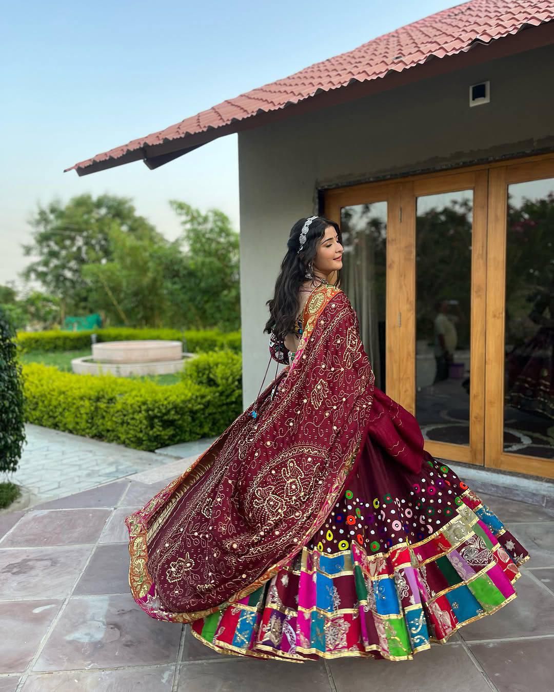 Colorful Chaniya Choli with mirror work and flowing 4 metre flair styled for Navratri