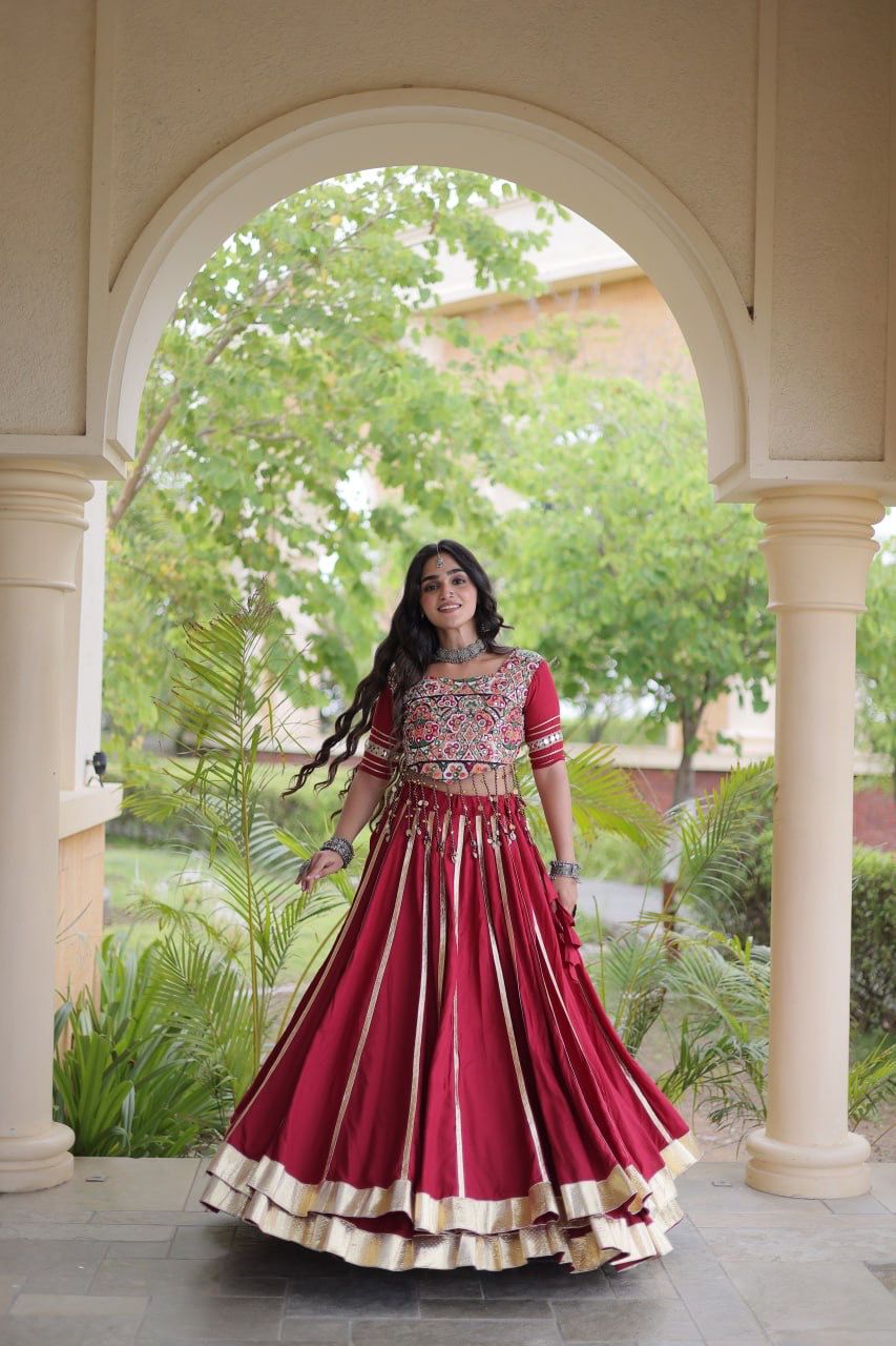 Maroon Indian lehenga choli styled with traditional jewellery for a festive look