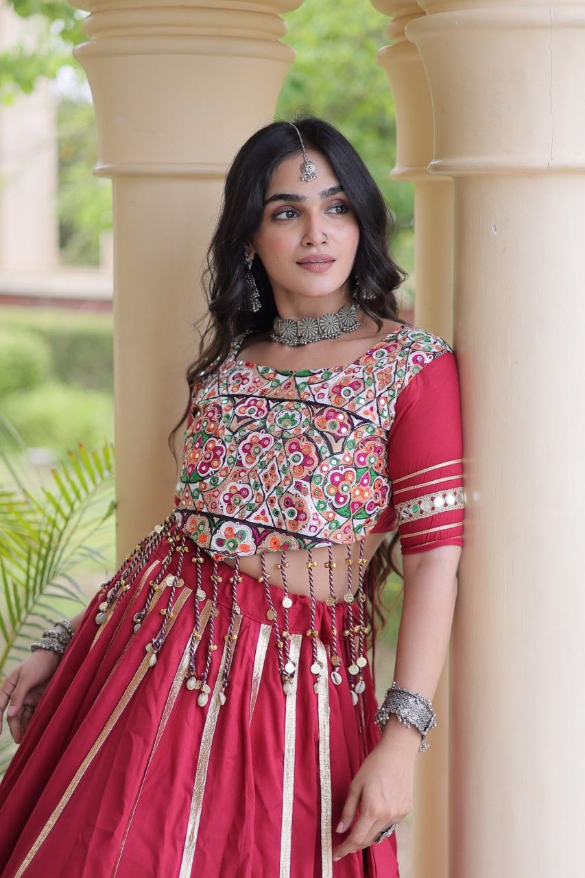 Maroon lehenga choli back view showing the blouse dori design and gota detailing