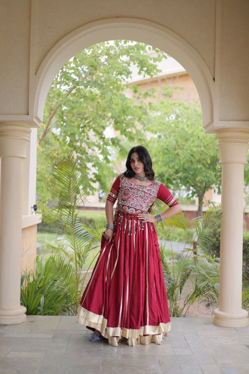 Maroon lehenga choli showing its dramatic flare and traditional gota patti border
