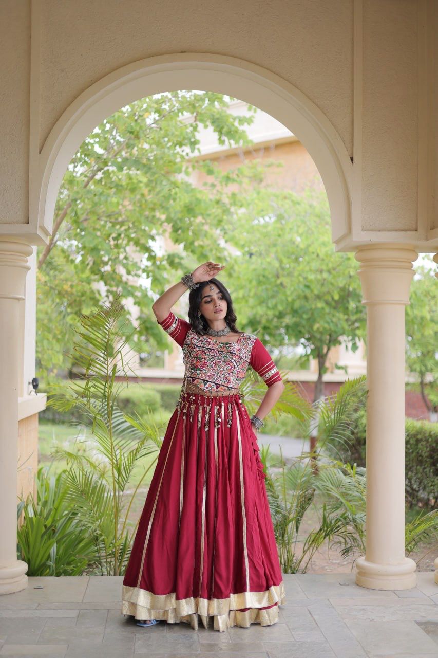 Maroon Navratri lehenga choli side view with embellished blouse and flowing skirt