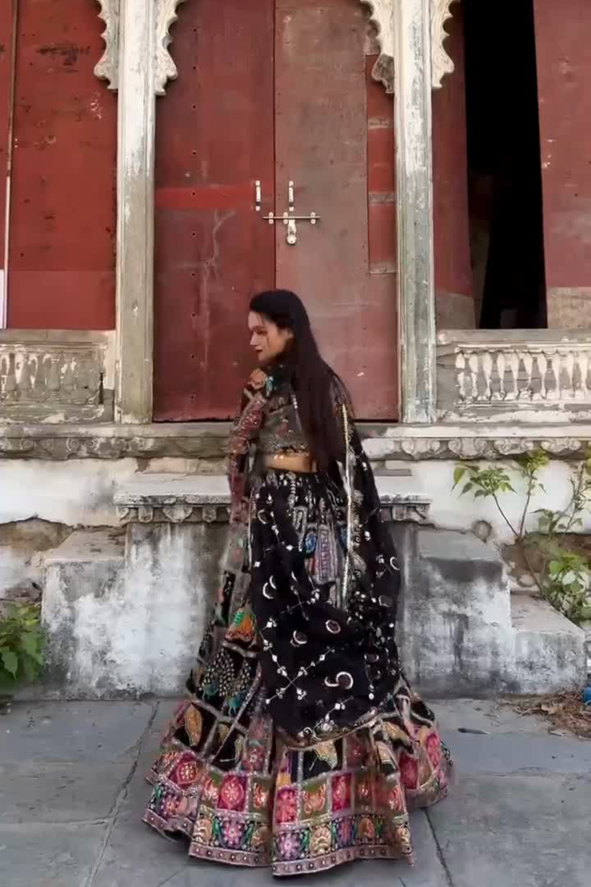 Mirror work chaniya choli for women with colorful traditional motifs and black base