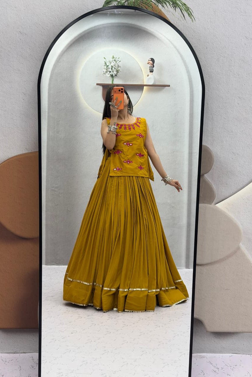 Side view of mustard Rion cotton lehenga choli with coordinated jacket and flair