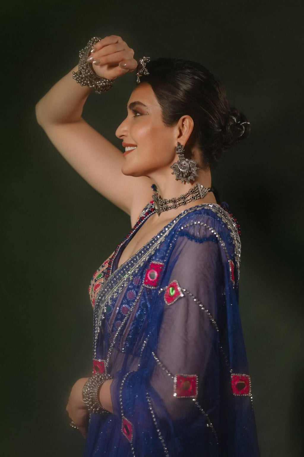 Navratri Chaniya Choli profile view highlighting mirror-work border and colourful printed motifs