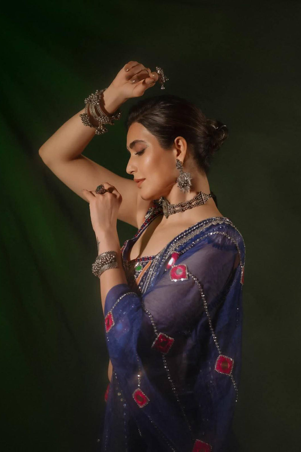 Navy blue Chaniya Choli side look with mirror-work dupatta and traditional festive styling