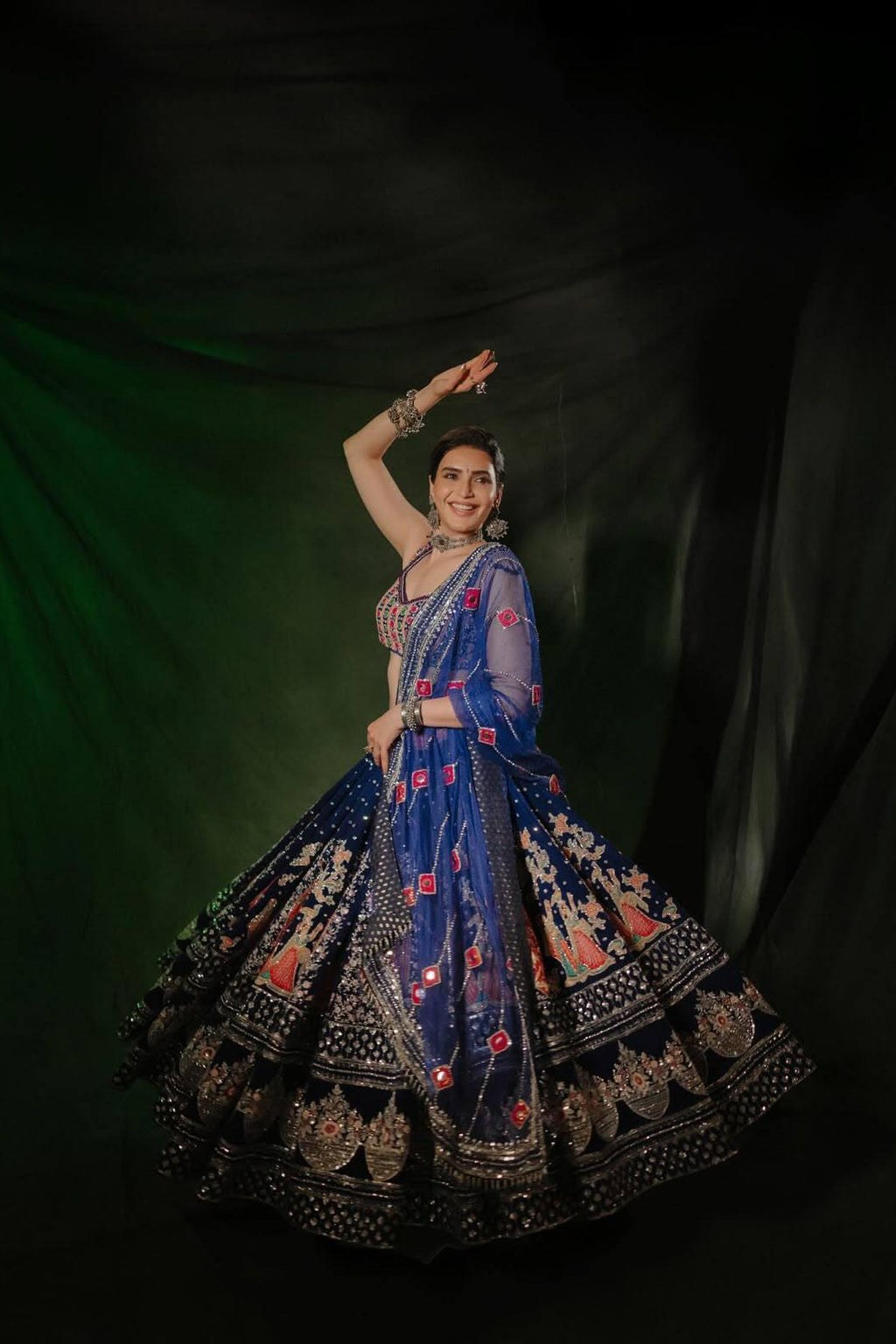 Navratri Chaniya Choli full look highlighting the printed lehenga panels and ornate mirror-work border