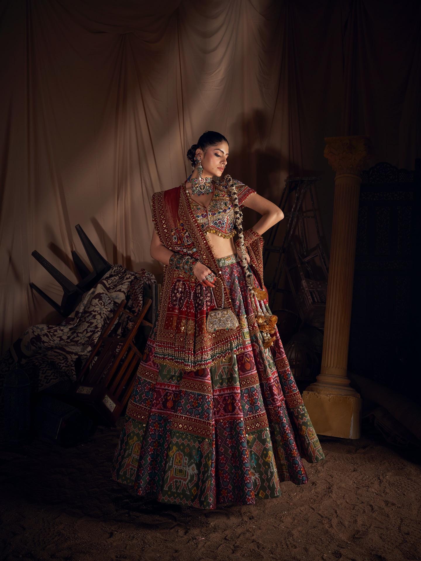 Close-up of Navratri lehenga choli showing colorful print and real mirror work details