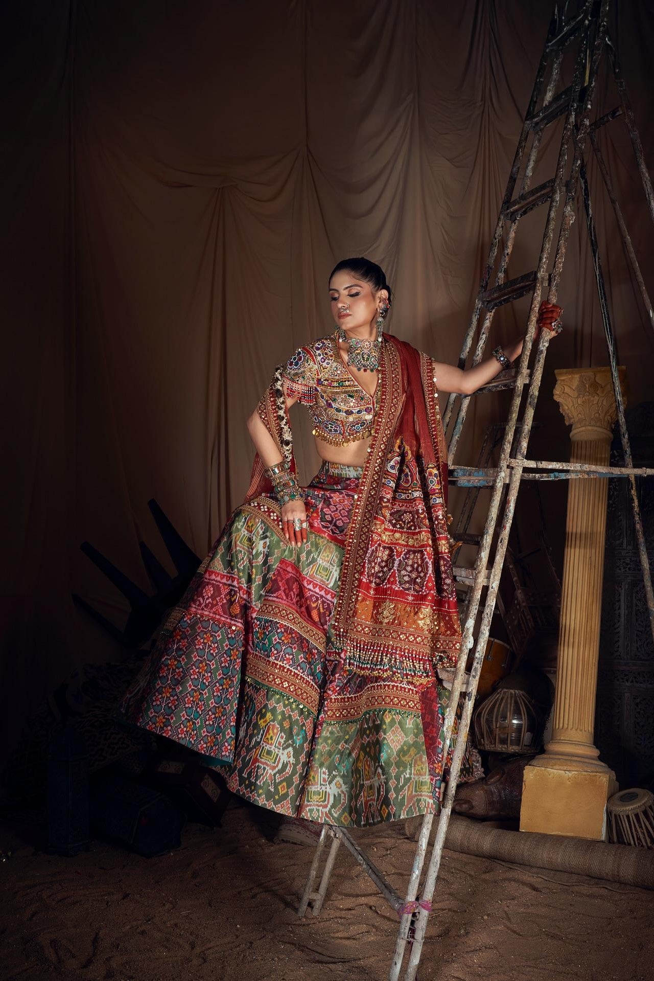 Front view of a vibrant Navratri lehenga choli featuring printed panels and mirror work