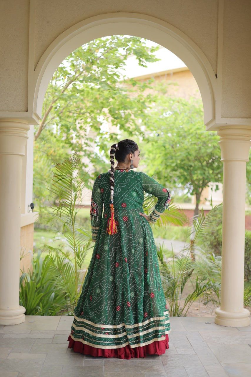 Front view of green and maroon Navratri lehenga choli with festive shrug