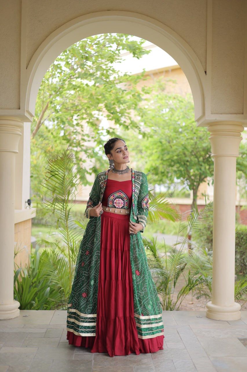 Flared maroon Navratri lehenga styled with a green Kutchi patchwork shrug