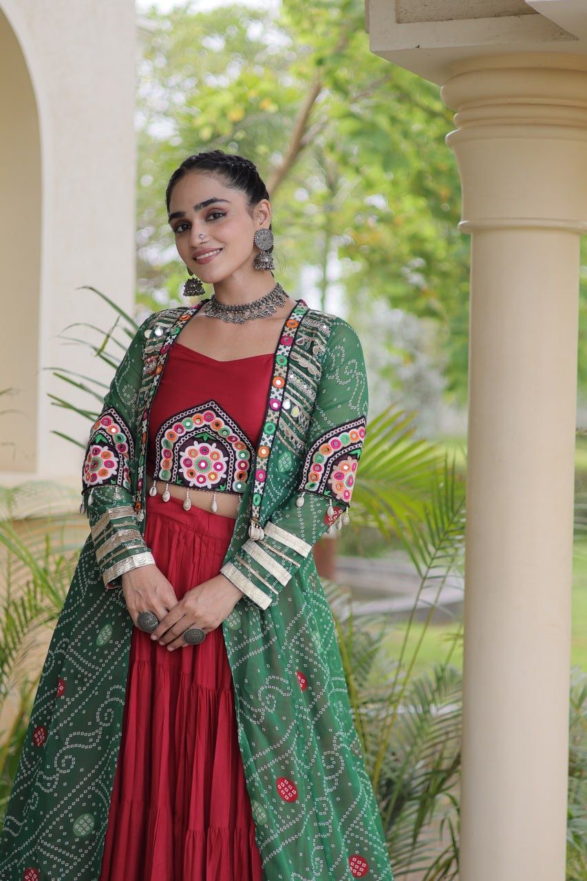 Close view of Kutchi patchwork blouse with green shrug and maroon lehenga