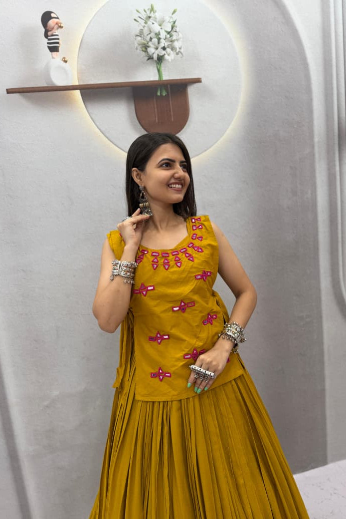 Mustard festive lehenga choli showing the full skirt, stitched choli and jacket