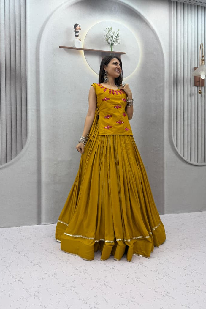 Mustard Navratri lehenga choli with flowing 6-meter flair and mirror-work jacket