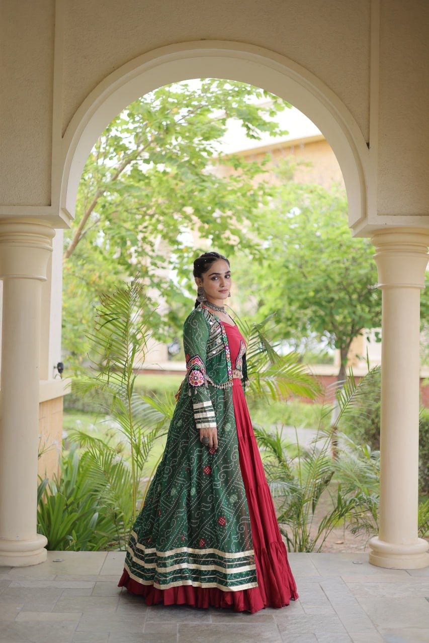 Side styling of green printed shrug over a maroon Navratri lehenga