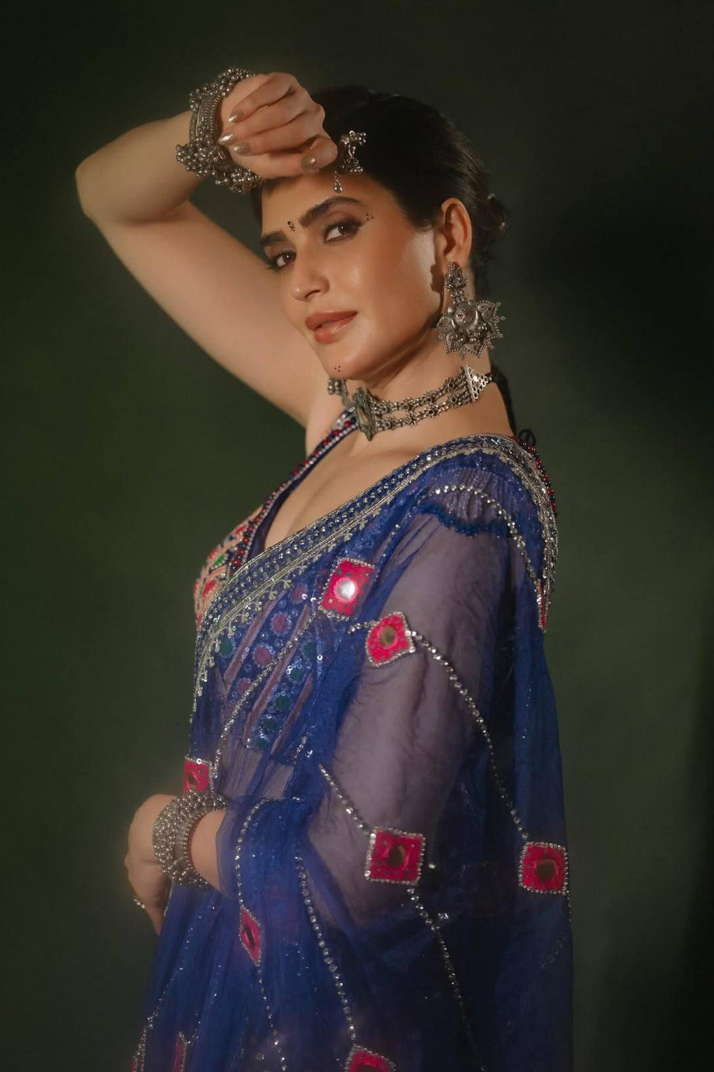 Navy blue Chaniya Choli portrait featuring real mirror work and detailed festive dupatta
