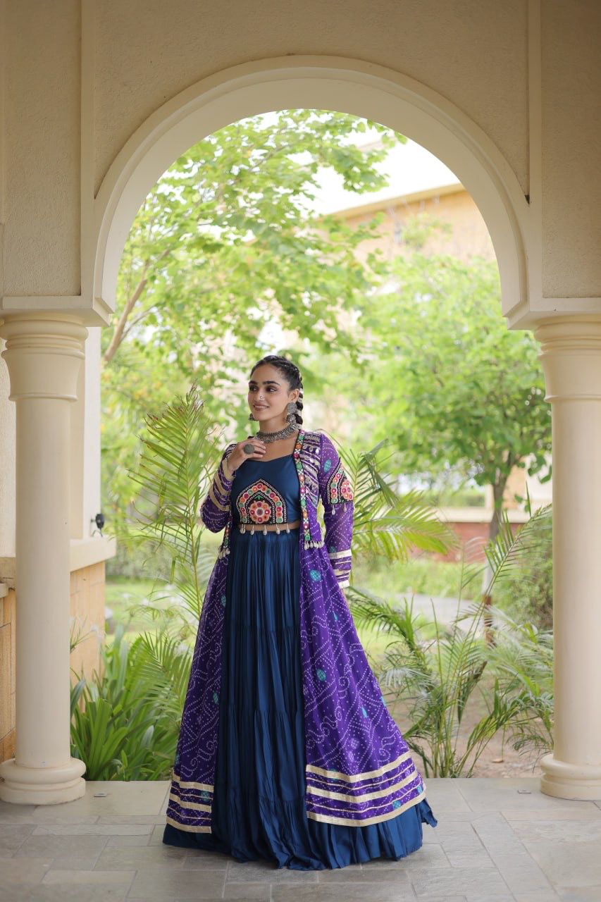 Full view of navy blue and purple Indian lehenga choli with Kutchi patchwork shrug styled for festive occasions