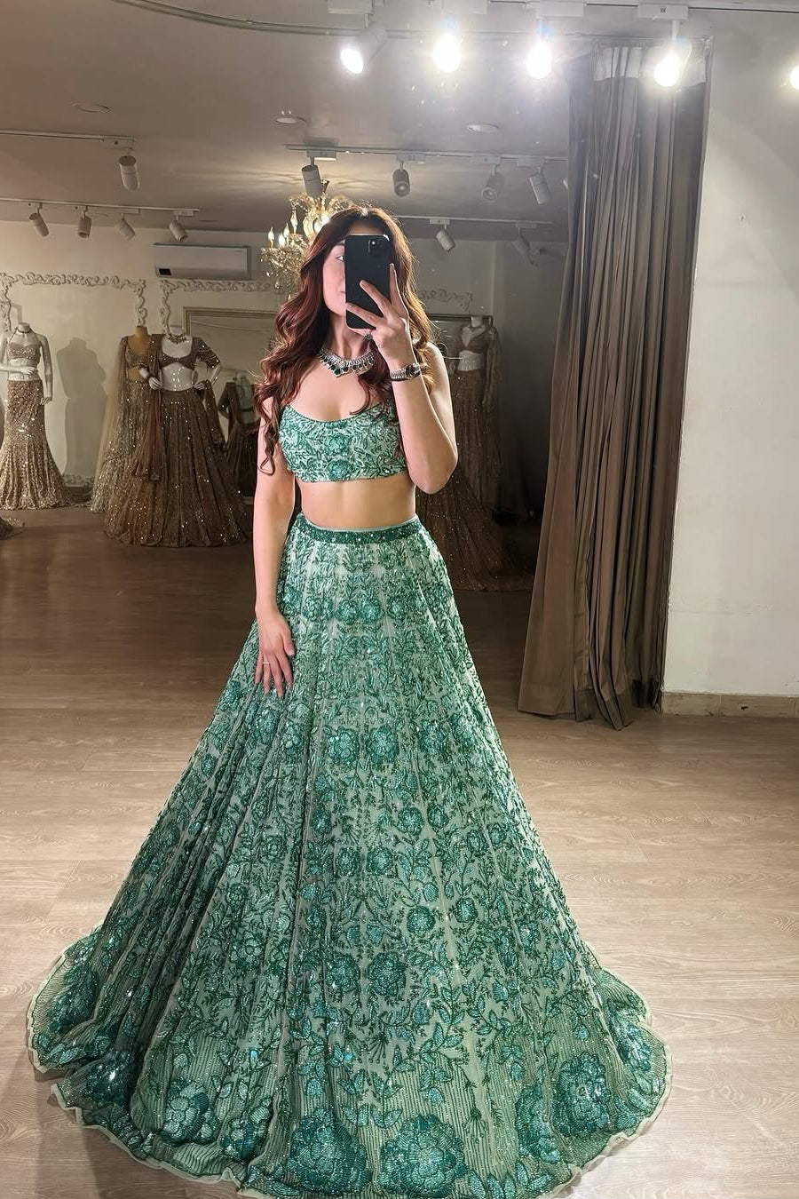 Pastel green georgette lehenga choli with rainbow sequins and floral thread work