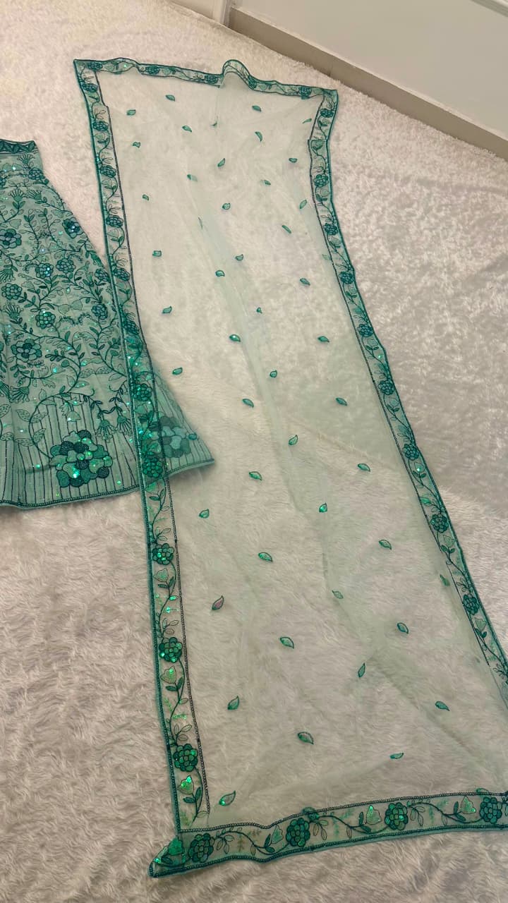 Pastel green georgette lehenga choli set displayed with embroidered floral sequin work