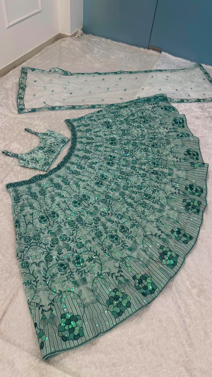 Pastel green lehenga fabric with floral dori, thread work and shimmering sequins