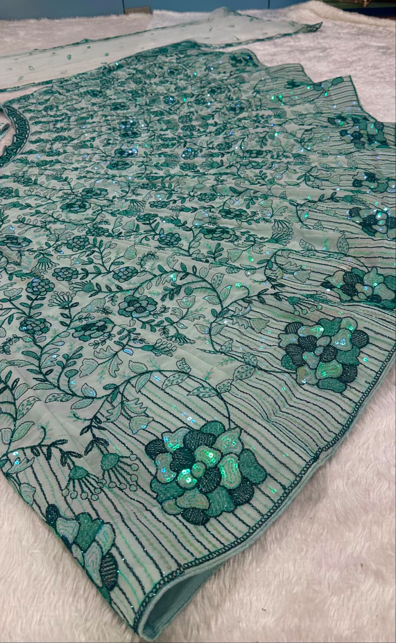 Net dupatta with pastel green border, rainbow sequins and delicate floral detailing