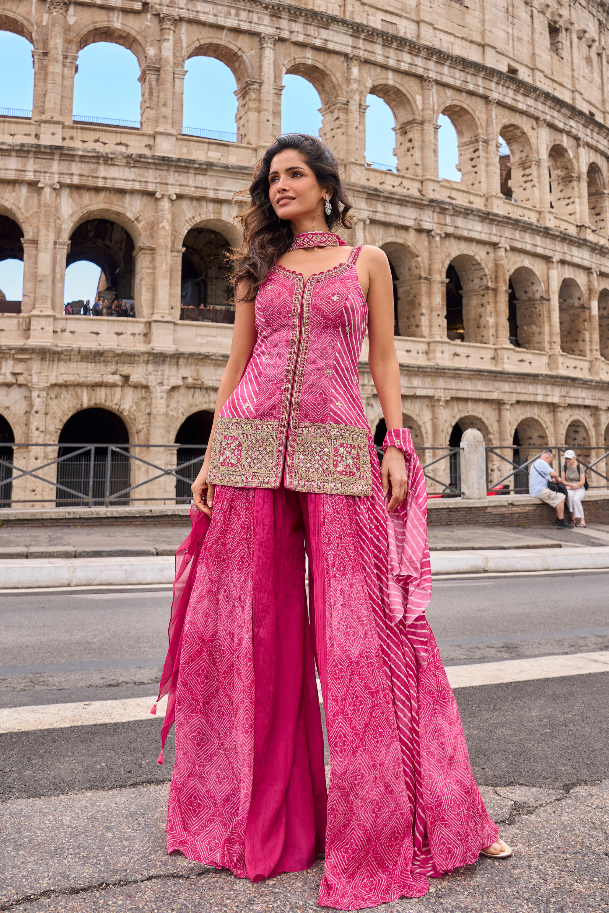 Pink Chinnon Silk sharara suit with Bandhani and Leheriya print, zari and embellished detailing