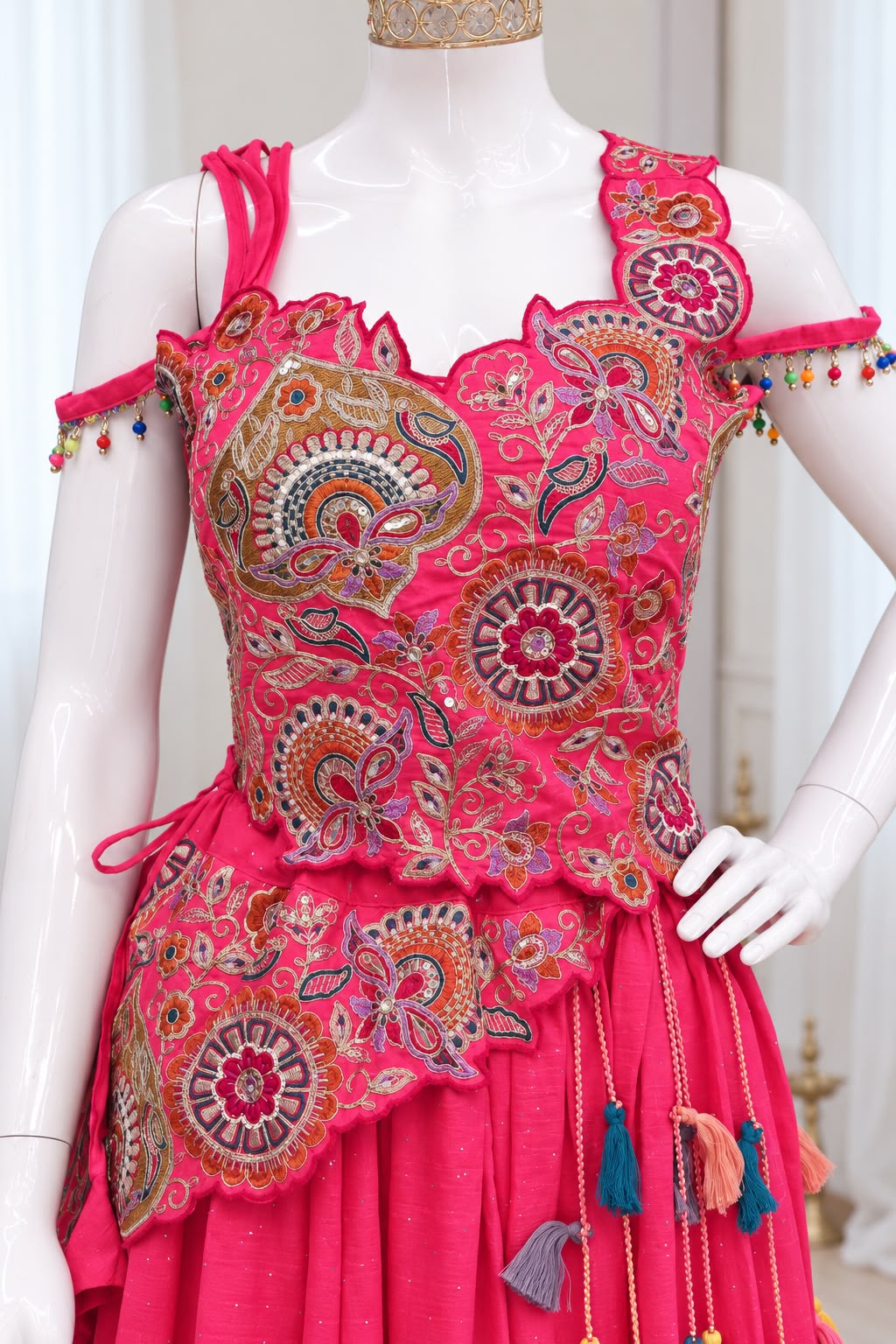 Pink embroidered choli with multicolour threadwork, sequins and decorative shoulder tassels