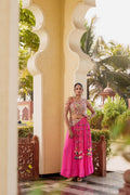 Pink embroidered lehenga choli styled on a model with colourful embroidery and tassel details