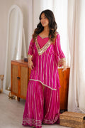 Pink sharara suit front view with long top, flared pants and gold detailing